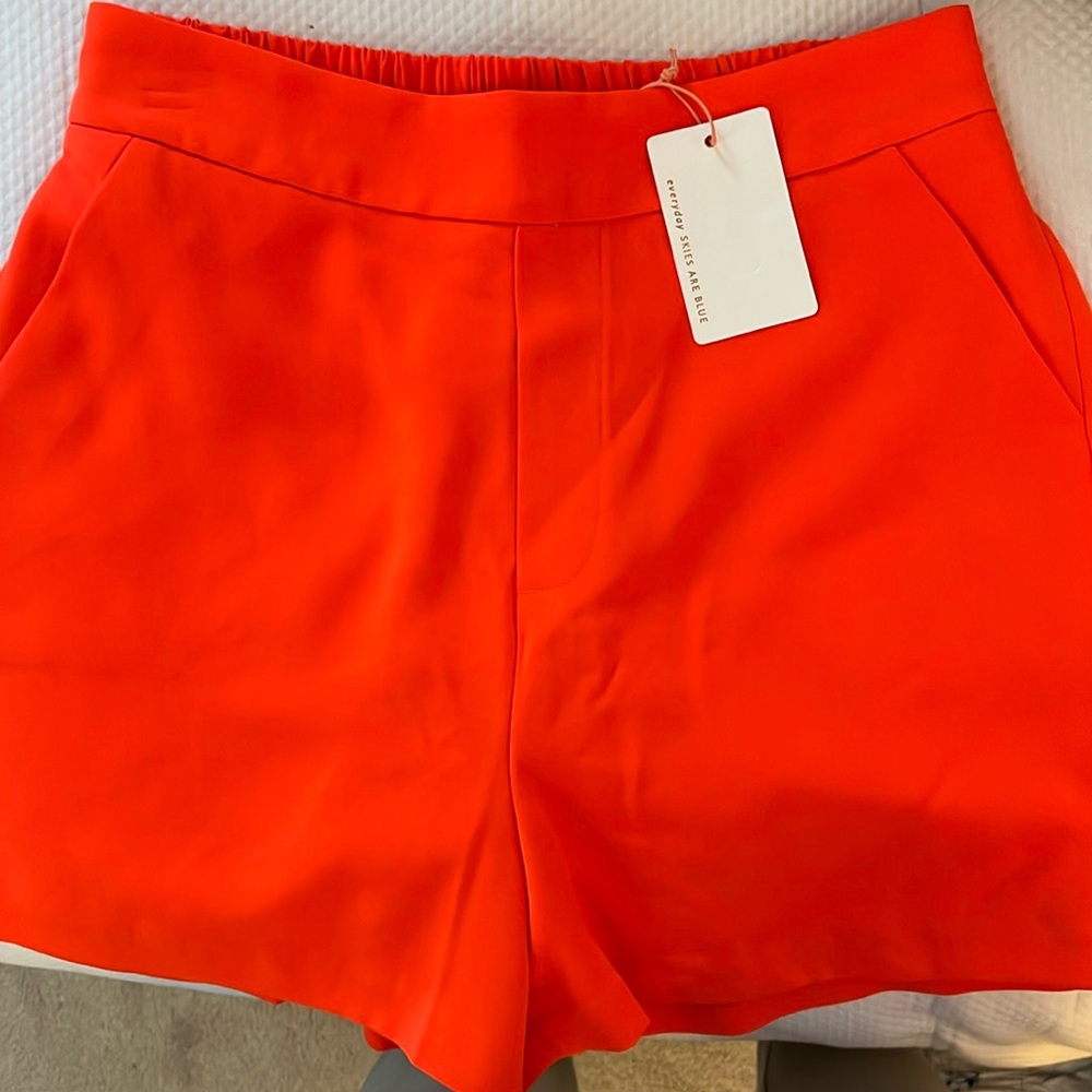 Skies are blue orange shorts